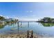 Picturesque waterfront view with calm water and neighboring houses at 409 161St Ave, Redington Beach, FL 33708