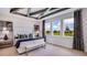 Main bedroom with plush bed and three windows overlooking the backyard at 4314 Pullet Ct, Lakewood Ranch, FL 34211