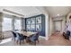 Formal dining room with a view to the foyer and a blue accent wall at 4314 Pullet Ct, Lakewood Ranch, FL 34211