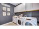 Bright laundry room, featuring white cabinets and Whirlpool appliances at 4314 Pullet Ct, Lakewood Ranch, FL 34211