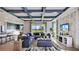 Spacious living room with a cozy sectional sofa and large windows at 4314 Pullet Ct, Lakewood Ranch, FL 34211