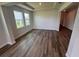 Open concept living room with hardwood floors and large windows at 4314 Pullet Ct, Lakewood Ranch, FL 34211