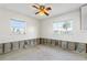Empty bedroom with two windows, currently undergoing renovations at 4610 Bay Crest Dr, Tampa, FL 33615