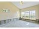 Bright bedroom with large windows and a ceiling fan at 4610 Bay Crest Dr, Tampa, FL 33615
