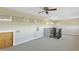 Bonus room with ceiling fan, windows, and access door at 4610 Bay Crest Dr, Tampa, FL 33615