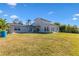 Two-story house with a large backyard and water view at 4610 Bay Crest Dr, Tampa, FL 33615