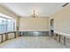 Under renovation, living room with exposed framing and new flooring at 4610 Bay Crest Dr, Tampa, FL 33615
