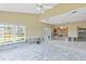 Living room with vaulted ceiling, lots of natural light, and French doors. Currently under renovation at 4610 Bay Crest Dr, Tampa, FL 33615