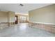 Home renovation showing exposed walls and flooring in living room at 4610 Bay Crest Dr, Tampa, FL 33615
