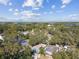 Wide aerial view of neighborhood, showcasing waterfront and homes at 605 E Spruce St, Tarpon Springs, FL 34689