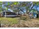 Large backyard with a screened porch and shed, providing ample outdoor space at 605 E Spruce St, Tarpon Springs, FL 34689