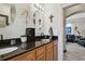 Elegant bathroom with double vanity and view into living area at 605 E Spruce St, Tarpon Springs, FL 34689
