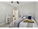 Cozy bedroom with a queen-size bed and access to another room at 605 E Spruce St, Tarpon Springs, FL 34689