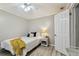 Cozy bedroom with a full-size bed and neutral decor at 605 E Spruce St, Tarpon Springs, FL 34689