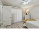 Well-lit bedroom with a full-size bed and neutral decor at 605 E Spruce St, Tarpon Springs, FL 34689