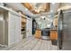 Kitchen boasts stainless steel appliances and light wood cabinets at 605 E Spruce St, Tarpon Springs, FL 34689
