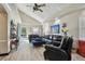 Open concept living room with hardwood floors and a vaulted ceiling at 605 E Spruce St, Tarpon Springs, FL 34689