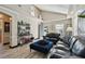 Light and airy living room with leather sofas and high ceilings at 605 E Spruce St, Tarpon Springs, FL 34689