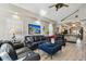 Spacious living room featuring leather furniture, hardwood floors, and an open floor plan at 605 E Spruce St, Tarpon Springs, FL 34689