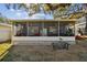 Spacious screened porch, perfect for relaxing and enjoying the outdoors at 605 E Spruce St, Tarpon Springs, FL 34689