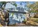 Outdoor storage shed with double doors and whimsical decor at 605 E Spruce St, Tarpon Springs, FL 34689