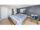 Spacious bedroom with a large bed, ensuite bathroom, and access to a balcony at 6382 Palma Del Mar S Blvd # 123, St Petersburg, FL 33715