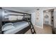 Bedroom with a bunk bed, built-in storage, and access to hallway at 6382 Palma Del Mar S Blvd # 123, St Petersburg, FL 33715