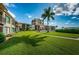 Ground level view of the community, showcasing manicured lawns and a building at 6382 Palma Del Mar S Blvd # 123, St Petersburg, FL 33715