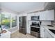 Updated kitchen featuring stainless steel appliances at 6382 Palma Del Mar S Blvd # 123, St Petersburg, FL 33715