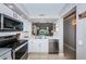 Modern kitchen with stainless steel appliances and white cabinets at 6382 Palma Del Mar S Blvd # 123, St Petersburg, FL 33715