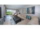 Spacious living room with comfortable seating and large art at 6382 Palma Del Mar S Blvd # 123, St Petersburg, FL 33715