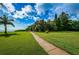Peaceful waterfront path with kayaks and lush greenery at 6382 Palma Del Mar S Blvd # 123, St Petersburg, FL 33715