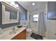 Bathroom with single vanity and bathtub shower combo at 703 Elkhorn Rd, Sun City Center, FL 33573