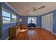 Bright bedroom with wood floors and built-in closets at 703 Elkhorn Rd, Sun City Center, FL 33573