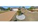 Front view of the house, showcasing a well-maintained lawn at 703 Elkhorn Rd, Sun City Center, FL 33573
