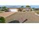 House exterior with a single-car garage and manicured landscaping at 703 Elkhorn Rd, Sun City Center, FL 33573