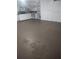 Clean garage with built-in shelving and storage cabinets, providing ample space for organization at 703 Elkhorn Rd, Sun City Center, FL 33573