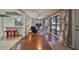 Cozy Gathering room with built-in shelving and a wood-burning fireplace at 703 Elkhorn Rd, Sun City Center, FL 33573