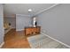 Spacious home office with wood floors and a large desk at 703 Elkhorn Rd, Sun City Center, FL 33573