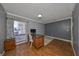 Bright home office with built-in desk and wood flooring at 703 Elkhorn Rd, Sun City Center, FL 33573