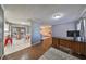 Open concept kitchen with granite countertops and stainless steel appliances at 703 Elkhorn Rd, Sun City Center, FL 33573
