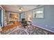 Bright living room with hardwood floors and access to other rooms at 703 Elkhorn Rd, Sun City Center, FL 33573