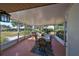 Relaxing screened porch with seating area and view of backyard at 703 Elkhorn Rd, Sun City Center, FL 33573