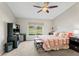 Main bedroom with king bed and view of golf course at 715 Masterpiece Dr # 715, Sun City Center, FL 33573