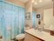 Guest bathroom with shower/tub combo and updated vanity at 7216 Orchid Lake Rd, New Port Richey, FL 34653