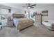 Spacious main bedroom with plush bed and dresser at 8272 Artisan Way, Seminole, FL 33777