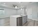 Stylish kitchen island with sink and dishwasher at 8306 N Marks St, Tampa, FL 33604