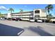 Condominium building with covered parking spaces for residents at 970 Virginia St # 109, Dunedin, FL 34698