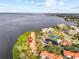 Aerial view of waterfront community with tennis courts and pool at 1814 Mariner Dr # 159, Tarpon Springs, FL 34689