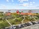 Aerial view showing condo building near waterfront with parking at 1814 Mariner Dr # 159, Tarpon Springs, FL 34689